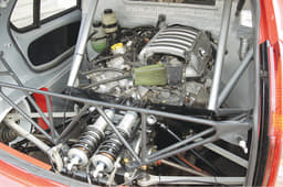 No seats in the back, but a massive racing motor and race car suspension.