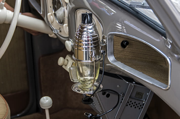 It even comes with its very own dash-mounted coffee maker, which runs off of a six-volt power outlet.