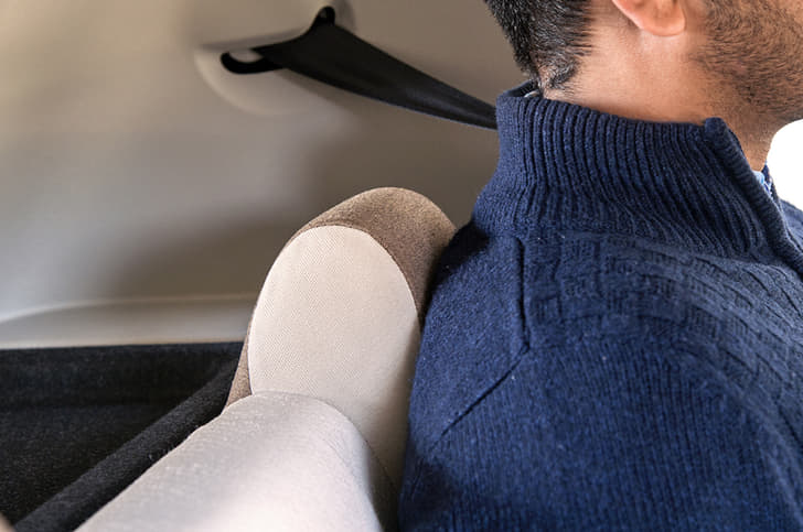 Fixed rear headrests are small and will poke into your back. 