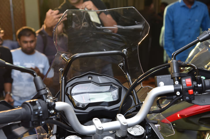 The windscreen is supported by a large bracket.