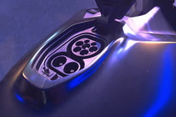 The charging port replaces the conventional fuel tank opening.