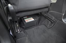 Lithium-ion battery under front passenger seat eats into foot room. 