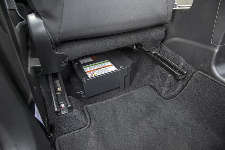 Lithium-ion battery under front passenger seat eats into foot room. 