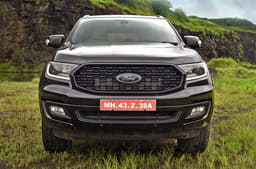 Smoked headlamps, a grille devoid of chrome and all-black bumper unique to the Sport.   