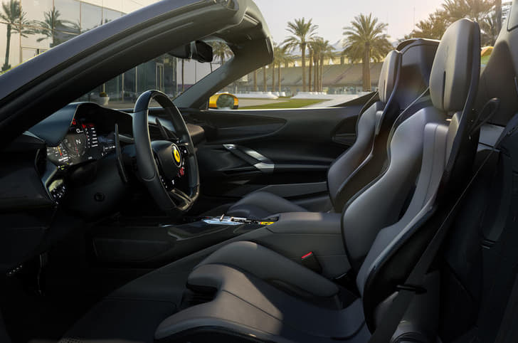 Ferrari has added trim elements in the cockpit that funnel air away from the passengers.  
