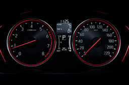 Instrument cluster houses traditional analogue dials with a central MID.