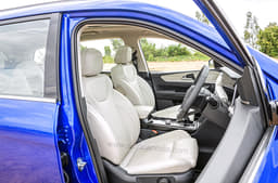 Features light beige-coloured upholstery for the seats.