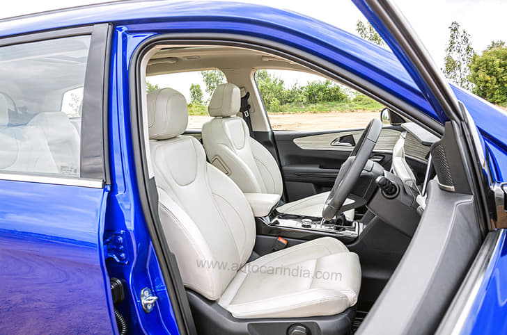 Features light beige-coloured upholstery for the seats.