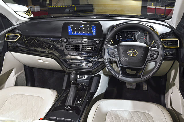 Safari Gold finished in black gets a black marble like finish on dash with subtle gold highlights. Image - 10592
