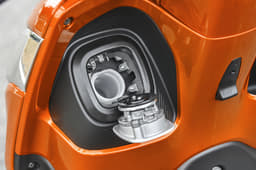 The fuel cap is located on the inside of the apron.