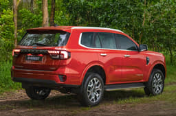 2022 Ford Everest rear three-quarters view in red.