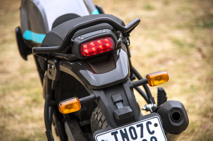 The bike gets a smaller pillion grab rail than the one on the Himalayan.