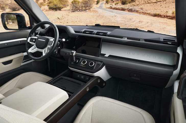 Dashboard design and infotainment system almost identical to other Defender models in the range. 