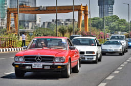 A Mercedes 450 SLC leading a BMW and a Corvette.
