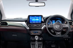 Gets a similar dual-tone theme inside the cabin with the same features as Fronx.