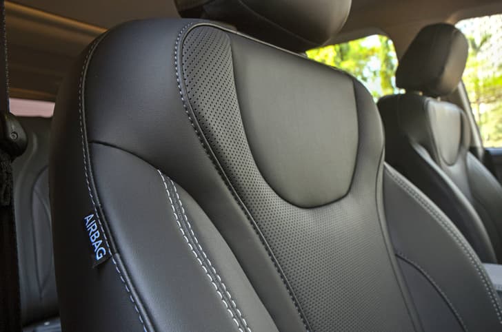 Contrast white stitching with the black seats. 