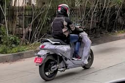 Yamaha electric scooter rear three quarter riding spy shot