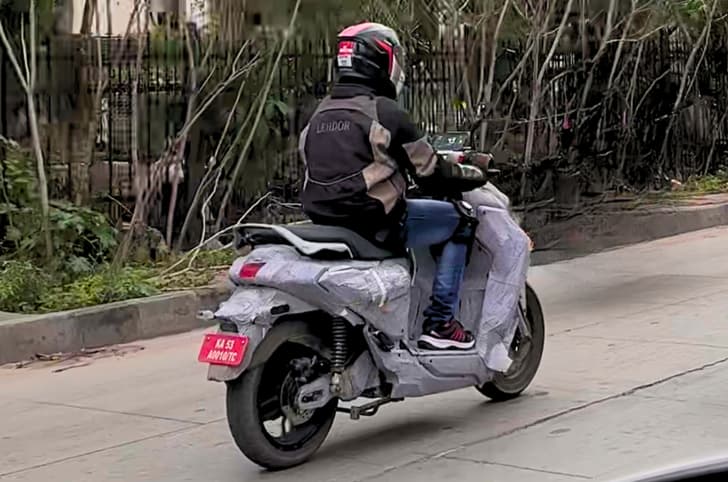 Yamaha electric scooter rear three quarter riding spy shot