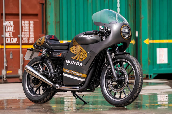 Honda CB350 in a fully-faired black and gold paint-scheme