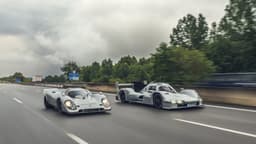 Porsche 963 RSP and 1970s 917 in motion on a track.