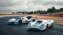 Porsche 963 RSP and 1970s 917 standing next to each other on a track