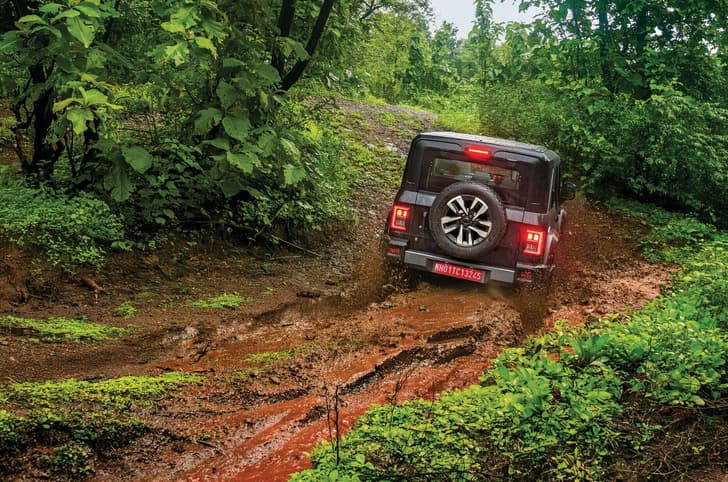 Mahindra Thar Roxx offroading exterior in slush