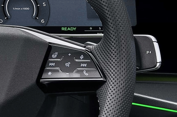 A gear-selector stalk behind the steering replaces the traditional unit.