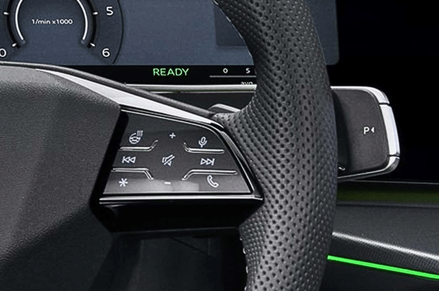 A gear-selector stalk behind the steering replaces the traditional unit. Image - 19695