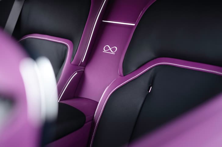 rolls royce spectre black badge rear seat infinity symbol