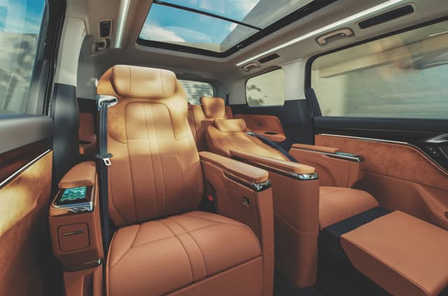 The second-row seats offer heating, ventilation, massage functions, and come with fold-out ottomans. Image - 19158