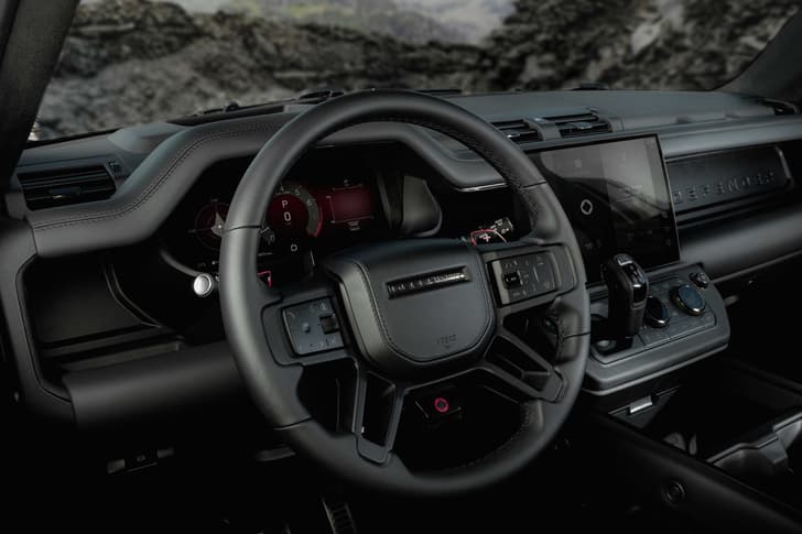 defender octa black edition in field