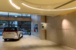 Rear image of the MG M9 in a MG select showroom