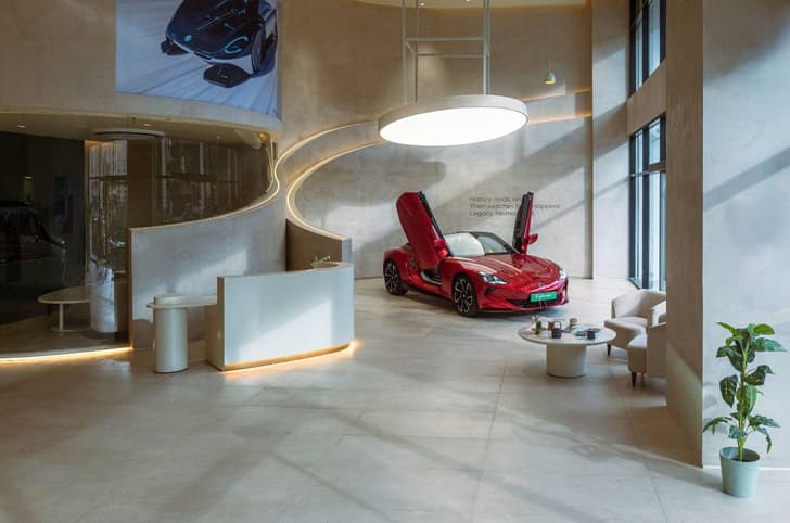 red MG cyberster in a mg select showroom