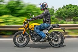 Triumph Scrambler 400 XC left side profile riding shot
