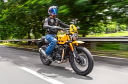 Triumph Scrambler 400 XC right front side riding shot