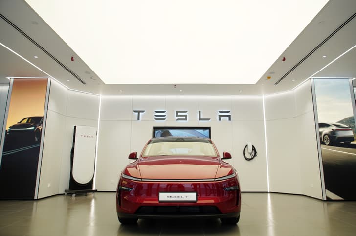 Tesla showroom India with Model Y and Supercharger 