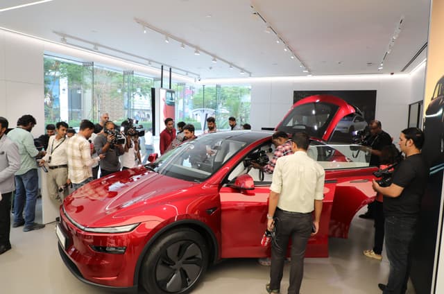 Fans and media checking out Tesla Model Y on brand's opening day in India. 