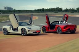 MG Cyberster exterior front and rear, rear and white, doors open