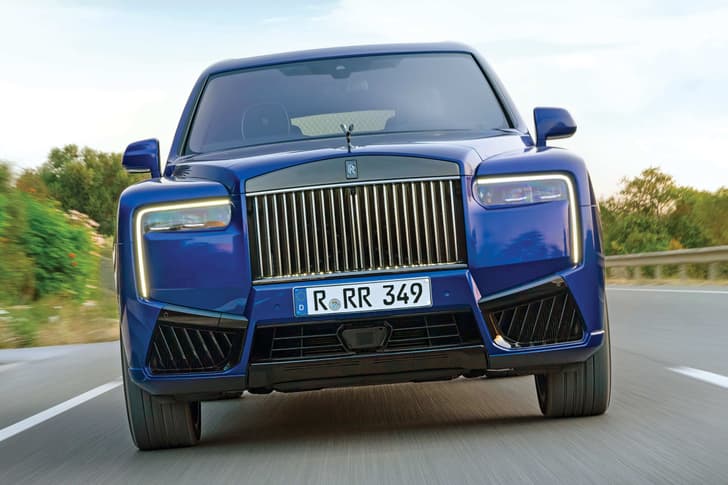 rolls royce cullinan black badge on road