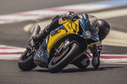 Suzuki GSX-R1000R 40th Anniversary Edition in yellow cornering shot