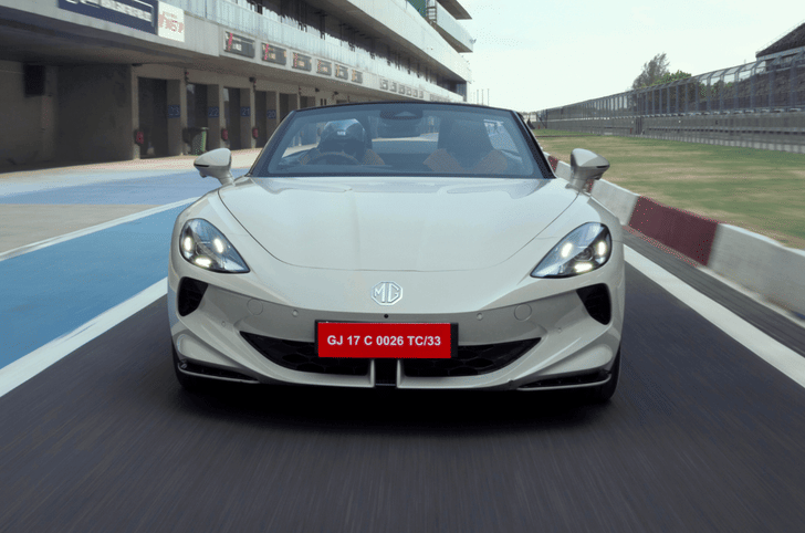 Front view of white MG Cyberster electric convertible on track