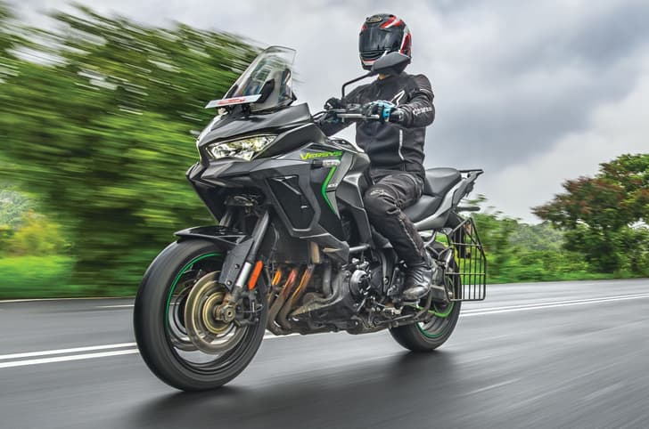 Kawasaki Versys 1100 front right riding shot in field