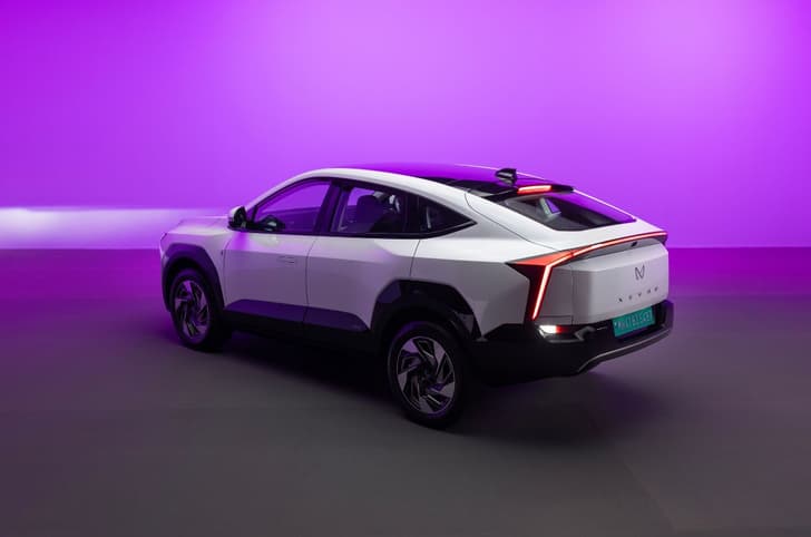 Mahindra XEV 9e Pack Two exterior white rear three quarter in studio