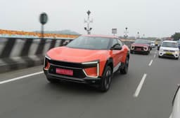 Mahindra BE 6 in orange driving on the road