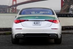 Rear view of Mercedes-Maybach S 680 Emerald Isle Edition with green and white two-tone finish and chrome accents.