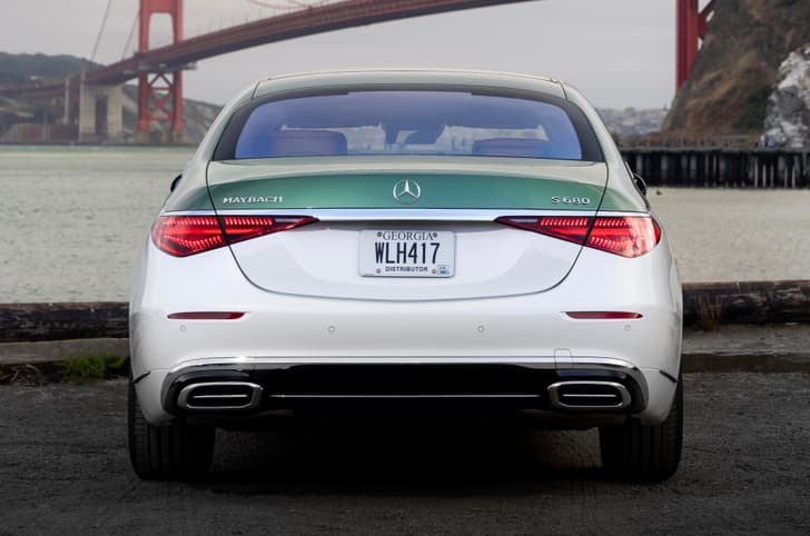 Rear view of Mercedes-Maybach S 680 Emerald Isle Edition with green and white two-tone finish and chrome accents.