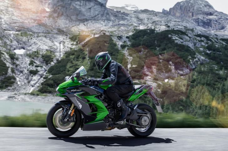 Ninja H2 SX left profile riding shot
