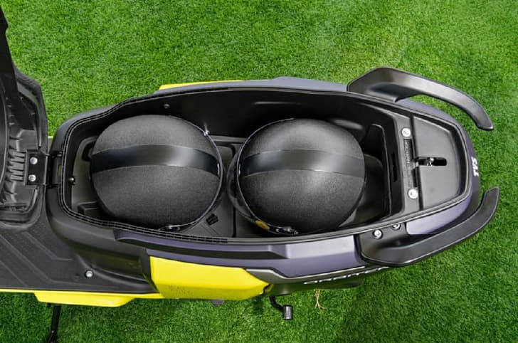 TVS Orbiter boot with two half faced helmets inside