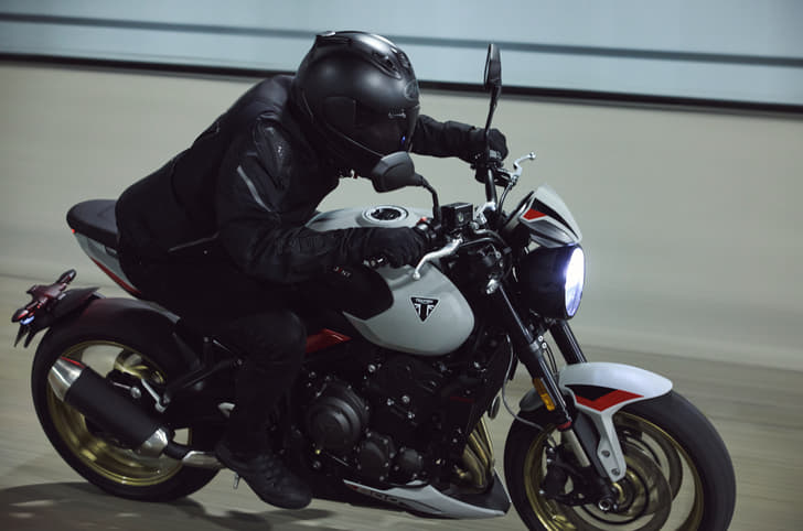 Triumph Trident 800 riding shot from side profile.