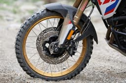The bike rides on 21-inch front and 17-inch rear spoke wheels.
